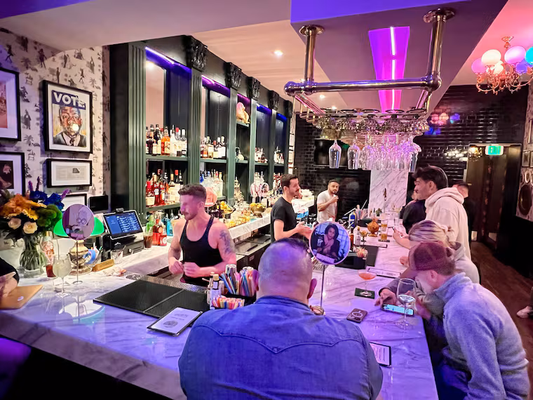 photo of Little Gay Pub’s Philadelphia interior, showing its LGBTQ+ décor and cocktail-bar atmosphere 2